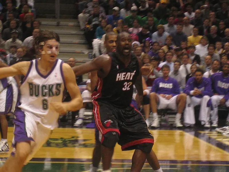 Shaquille O'Neal (Miami Heat #32, black road uniform) calls for the ball in the post as a Milwaukee Bucks defender cuts past, Heat at Bucks.